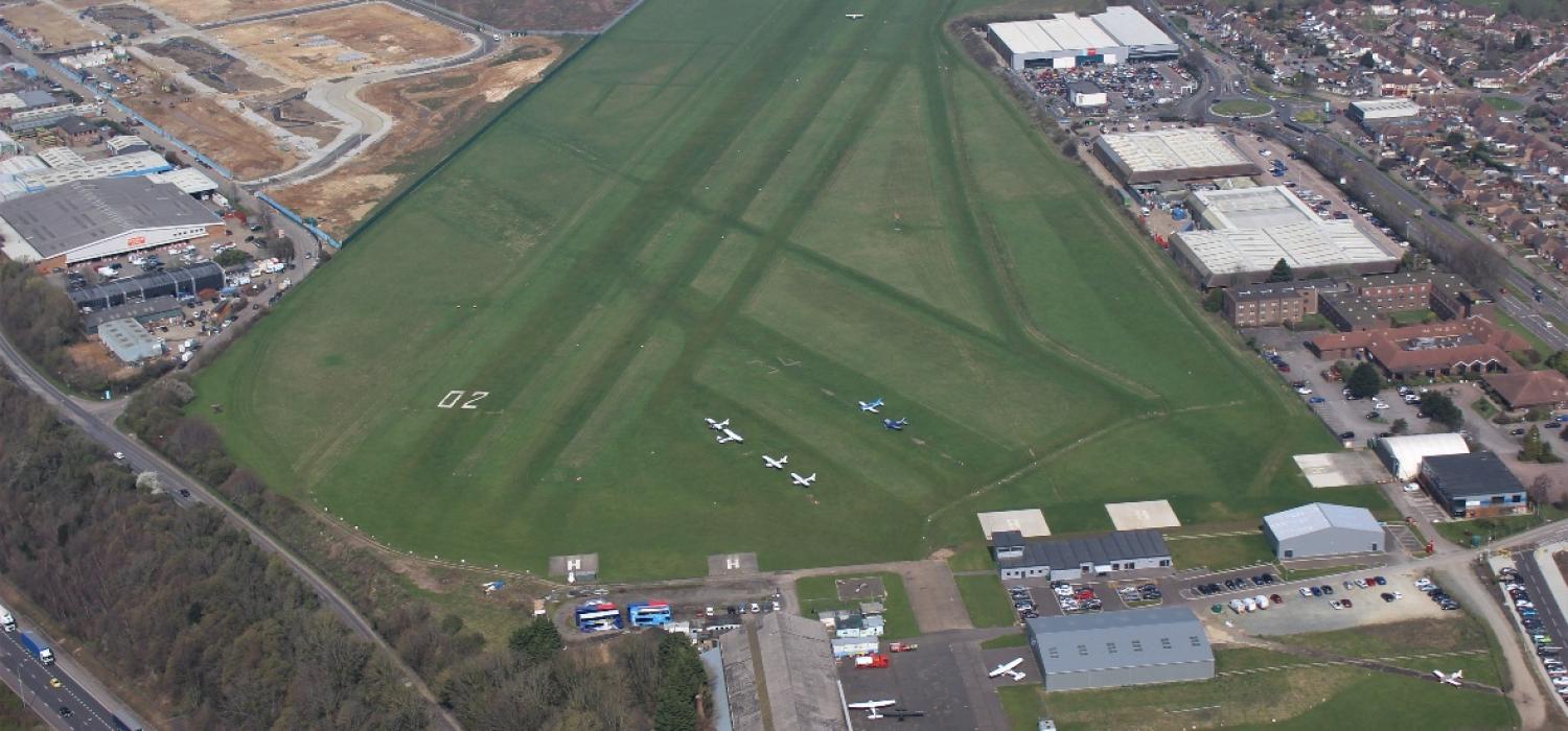 Aerial view of Rochester Airport's grass runways in Medway, Kent